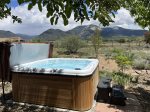 Beautiful hot tub with mountain views on flagstone patio